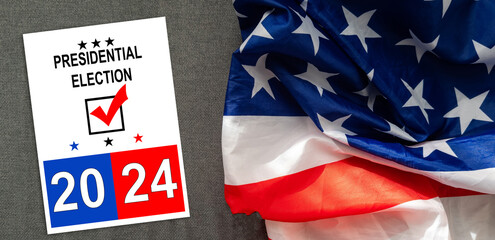 Politics and voting concept. Presidential election 2024 text on white paper over the American flag...