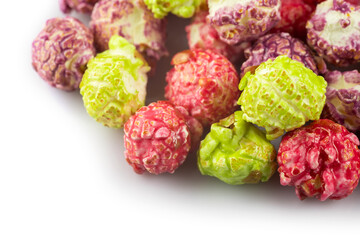 a pile colorful popcorn on white background