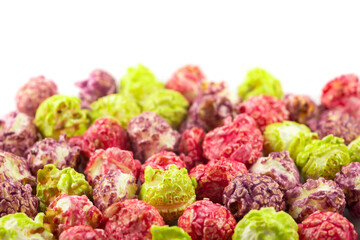 a pile colorful popcorn on white background