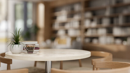 A neutral round marble table with wooden armchairs in a cozy contemporary coffee shop or living room