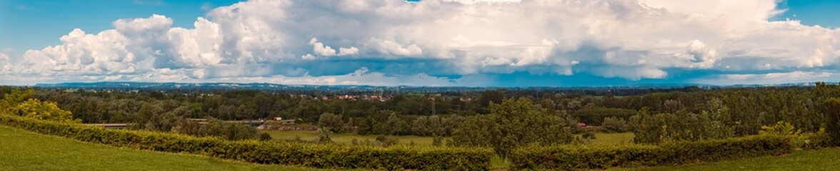 High resolution stitched alpine summer panorama with a huge storm cloud over Bavaria seen from Obernberg am Inn, Upper Austria, Austria