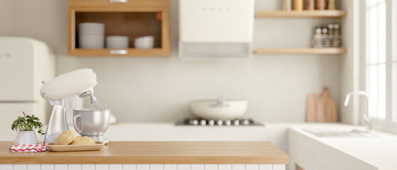 A dough kneading mixer blender on a wooden kitchen island in a contemporary minimalist kitchen.