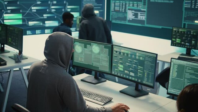 Cyber security specialist conducting cyber surveillance and threat detection in a governmental agency. Professional hackers team managing cybercrime prevention and malware detection. Camera B.