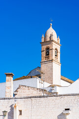 Bell tower of the Church of Saint Lucia in Alberobello, Italy