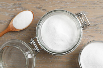 Baking soda on wooden table, flat lay