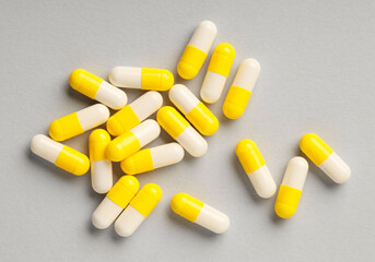 Many antibiotic pills on grey background, top view. Medicinal treatment
