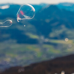 Alpine summer view with soap bubbles at the famous Rossfeld panorama road near Berchtesgaden, Bavaria, Germany