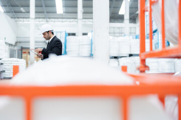 American male engineers industrial personnel receive rigorous training to maintain safety standards and operational excellence. There are plastic rolls waiting to be exported to the world market.