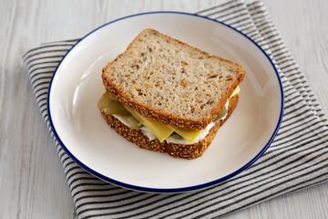 Homemade Pickle Sandwich with Mayo and Cheese on a Plate, side view.