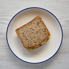 Homemade Pickle Sandwich with Mayo and Cheese on a Plate, top view.