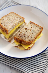 Homemade Pickle Sandwich with Mayo and Cheese on a Plate, side view.