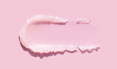 cosmetic smear peeling scrub texture on pink background
