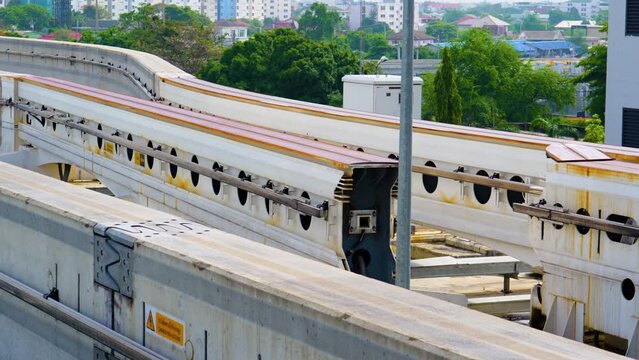 Switching change transition move direction of the track Modern mass transit. Rail transportation. Driverless straddle monorail on concrete guideway beam with conductor rail. Monorail technology
