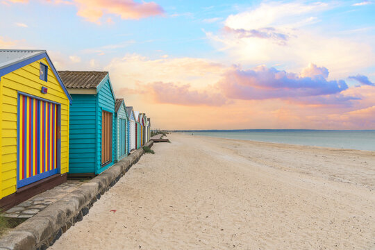 Colorful beach huts at sunset in Melbourne, Australia. 