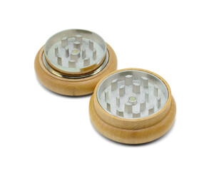 Weed grinder or herb grinder made of wood and steel for cannabis or plant on isolated white background.