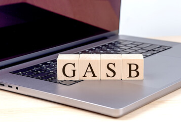 GASB word on wooden block on a laptop , business concept