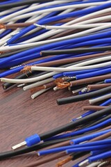 Copper stranded mounting electrical wires in colored insulation for electrical equipment. Close-up. Soft focus.