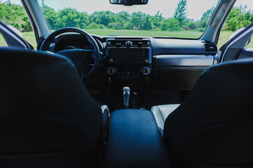 Interior of off road car in the rainy forest mountains