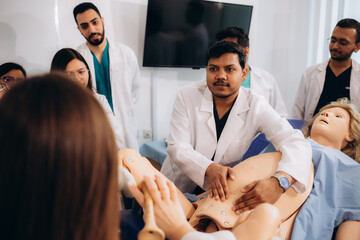 Students of obstetrics and gynaecology learn to deliver babies