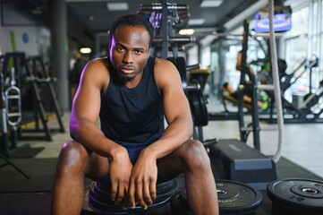 Fototapeta premium Sports, fitness, healthy lifestyle. African man in the gym.