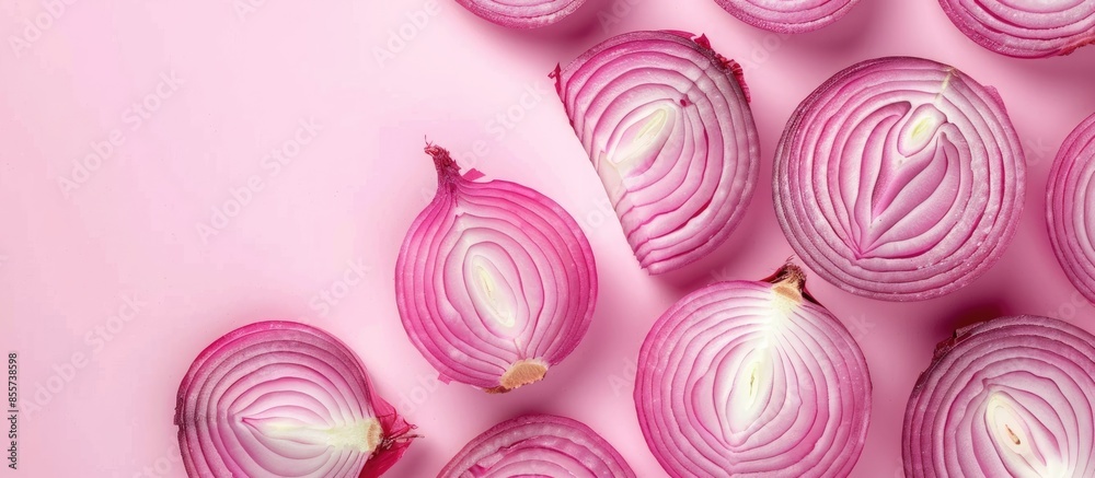 Fototapete Red sliced onion Isolated on pastel background. Food. with copy space image. Place for adding text or design