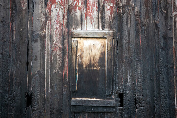 detail of a burnt wooden building wall