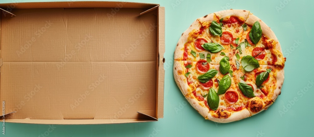 Aufkleber Pizza in a cardboard box with clipping path pastel background. with copy space image. Place for adding text or design