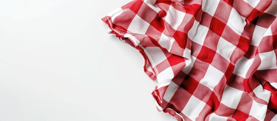 Fototapeta premium Red and white fabric tablecloth checkered on white background with copy space. Copy space image. Place for adding text or design