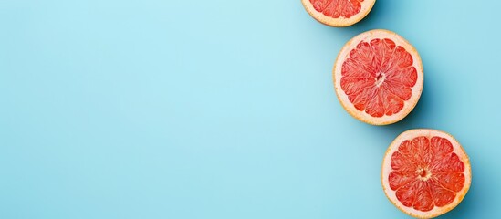 Red grapefruit, isolated on the pastel background. Food. with copy space image. Place for adding text or design