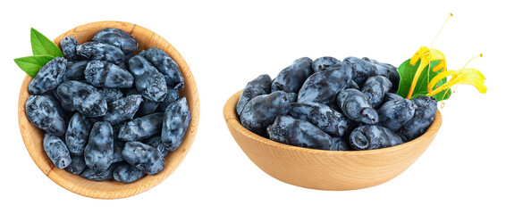 Fresh honeysuckle blue berry in wooden bowl isolated on white background with full depth of field. Top view. Flat lay