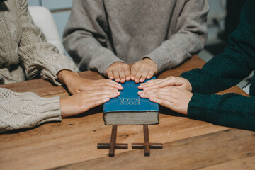 Christians are congregants join hands to pray and seek the blessings of God.