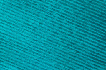 closeup of striped paper stained with turquoise color