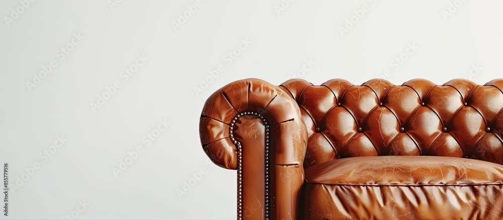 Poster stylish brown leather sofa on white background. with copy space image. place for adding text or desi