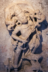 Hindu god stone carving sculpture found in a temple, Udaipur, Rajasthan, India