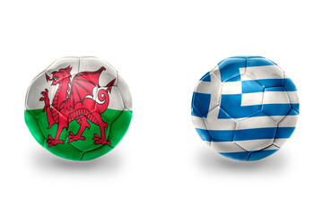football balls with national flags of greece and wales ,soccer teams. on the white background.