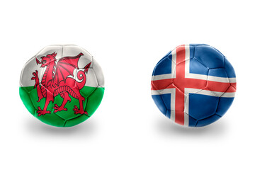 Obraz premium football balls with national flags of iceland and wales ,soccer teams. on the white background.
