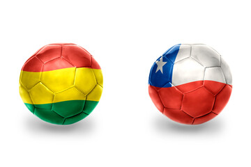 football balls with national flags of chile and bolivia ,soccer teams. on the white background.