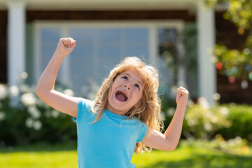 Child imagining idea concept. Lifestyle closeup portrait of funny kids face outdoors. Summer kid outdoor portrait. Excited face, amazed emotions of cute little kid boy.