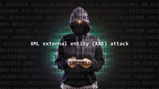 Cyber attack xml external entity XXE attack text in foreground screen, anonymous hacker hidden with hoodie in the blurred background. Vulnerability text in binary system code on editor program.