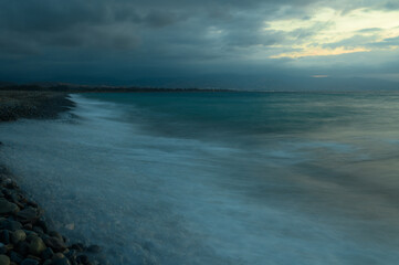 Very beautiful mediterranean seascape with setting sun on sunset. Waves crash on rocks in nature. 2