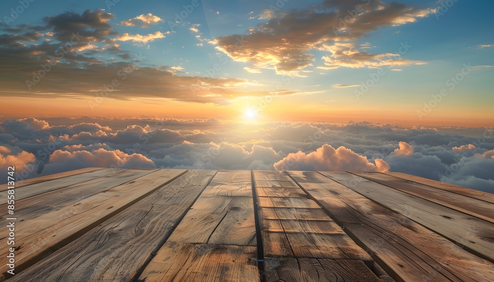 Wall mural Wooden table top with view of sunset above the clouds. Product display background