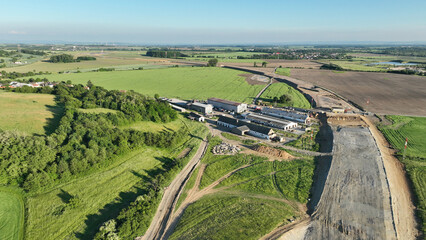 Highway destruction village in construction drone aerial Czech Prerov, agricultural land fields, remove of people houses and buildings land grabbing extension works additional lanes way new road