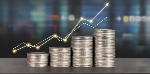 Stack of coin with trading graph, financial investment concept