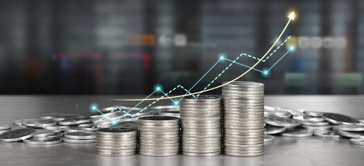 Stack of coin with trading graph, financial investment concept