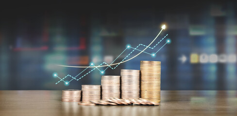 Stack of coin with trading graph, financial investment concept