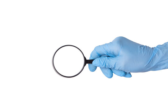 Woman's hand in a blue medical glove holding a magnifying glass or loupe. Mockup or template with round empty space for text and design, isolated on white background. Medicine and health concept