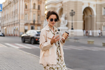 stylish beautiful woman walking in city street summer fashion trend