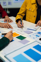 UX developer and ui designer brainstorming about mobile app interface wireframe design with...