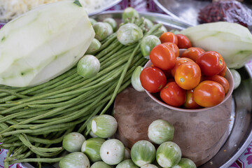 Tomatoes and ingredients for making papaya salad