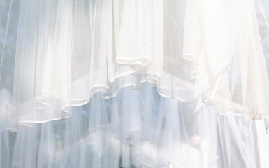 The white curtains are wavy and streaky.